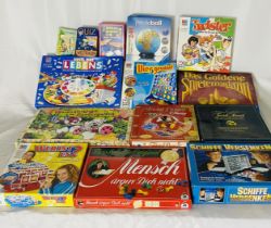 A collection modern and vintage board games including Connect 4, Disney Trivial Pursuit, Guess