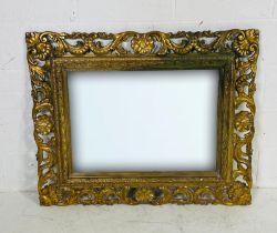 An ornate gilt framed mirror