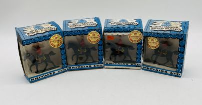 Four boxed Britains Royal Canadian Mounted Policeman plastic figurine models (699)