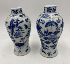 A near pair of Chinese blue and white baluster vases, both with four character mark to underside,