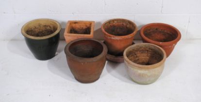 A small quantity of various sized garden pots, including some terracotta, some glazed