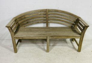 A Lutyens style wooden garden bench
