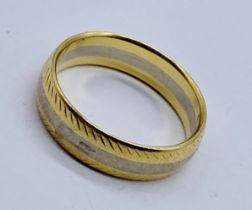 An unmarked gold (tested 18ct) wedding band, weight 6g