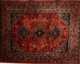 An Afghan red ground rug. 194cm x 137cm