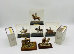 A collection of six cased mounted figurines, along with two figurines on wooden bases (both A/F)