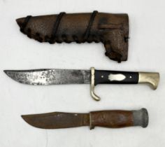 A William Rodgers hunting knife with leather sheath along with another wooden handled Bukta knife