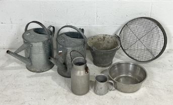 A collection of various galvanised items including watering cans, sieve etc.