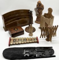 A collection of various items including a wool winder, vintage children's xylophone, African mask