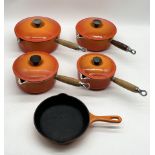 A collection of five Le Creuset pans including numbers 22, 20, 18 & 16 saucepans and number 20