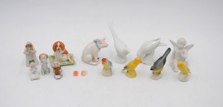 A small collection of miniature ceramic figures, including a figure of a spaniel by Basil Matthews