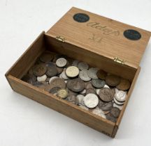 A collection of various coinage including a small amount of silver