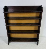An oak freestanding bookcase - height 122cm, width 104cm, depth 21cm