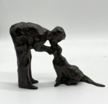 A small bronze sculpture of a man and his dog, signed by Linda Prokop "Unconditional", height 9.5cm