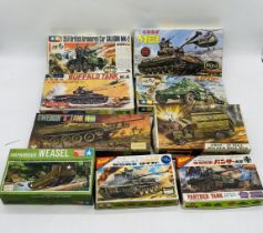 A collection of nine boxed military plastic construction kits including two Nichimo tanks, two