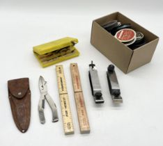 A collection of fishing equipment including two Hardy rod carriers, selection of fishing flies and