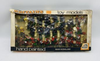 A collection of Britains military marching bands plastic figurines including Royal Marines, U.S Band