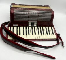 A Hohner Tango IM accordion with soft cover