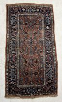 An Eastern red ground runner with geometric and floral patterns