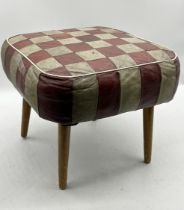 A mid-century stool with chequer board pattern leather seat