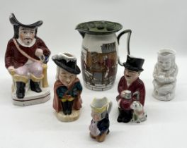 A collection of character jugs including Staffordshire Cavalier along with a Royal Doulton Series