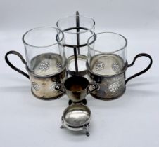 A pair of glasses with hallmarked silver holders, one other similar and a small silvre salt and