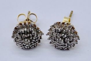 A pair of diamond cluster earrings set in 9ct gold