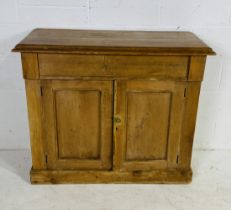 A Victorian pine cupboard with single drawer over - height 90cm, width 107cm depth 46cm