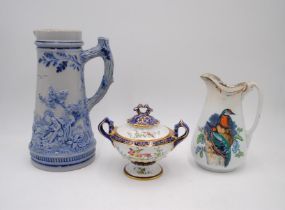 A Royal China Works Worcester lidded urn with gilt decoration along with a Wedgwood Woodpecker jug
