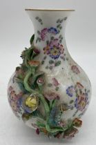 A continental porcelain baluster vase with hand painted and applied floral decoration, Meissen style