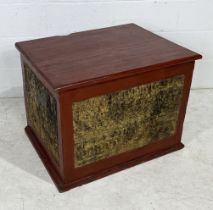 An antique Burmese manuscript chest with red lacquered finish and decorated gilt panels on three