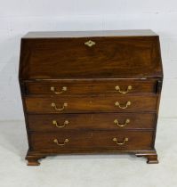 A Georgian mahogany bureau with inlaid decoration to inner cupboard - height 105cm, width 109cm,