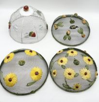 Four vintage wirework food domes decorated with floral detail