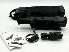 A Pulsar Digisight N550 digital rifle scope with accessories in carry case
