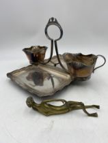 A silver plated strawberry set along with a mid century recumbent brass figure of a lady