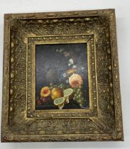 A reproduction oil painting of still life in ornate gilt frame