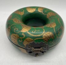 A Chinese lacquered necklace box with gilded decoration, approx.17cm diameter