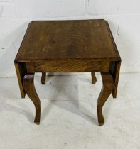 An Edwardian drop leaf occasional table