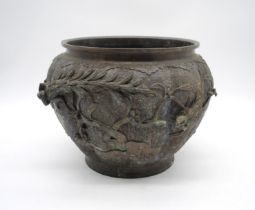A Japanese Meiji period bronze jardinière, of gourd form decorated with peacocks and floral