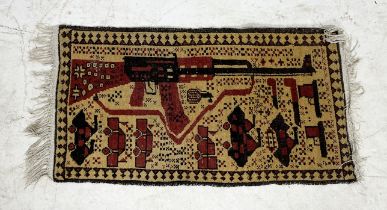A small hand-woven Afghan war/conflict rug with images of weaponry and military vehicles