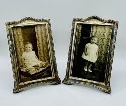 A pair of hallmarked silver photo frames- 1 glass cracked
