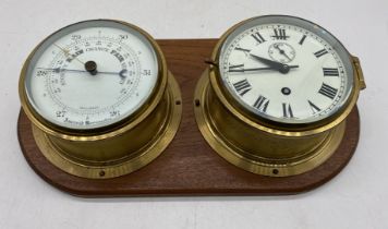 An oak mounted ships clock and aneroid barometer, each diameter 16.75cm