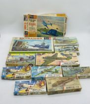 A collection of eleven boxed Airfix & Revell plastic construction kits in the form of military