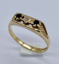 A 9ct gold diamond and sapphire three stone ring