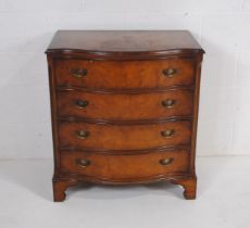 A reproduction serpentine fronted chest of four drawers - length 76.5cm, depth 52cm, height 83cm