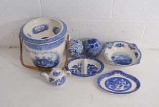 A small quantity of blue and white china, including a slop pail, two decorative balls etc.