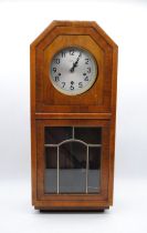 A 'Tymo' Art Deco wooden wall clock - length 31cm, height 72.5cm