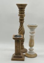 Three large candlesticks, height of tallest 53cm