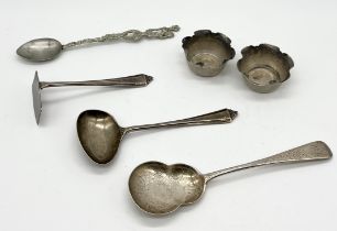 A small collection of hallmarked and other silver items including a pair of salts