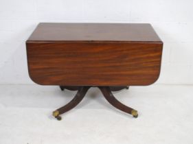 A Georgian mahogany sofa table with drawers at both ends