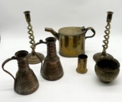 A collection of brass and copper including pair of Eastern copper jugs, brass candlesticks, trench